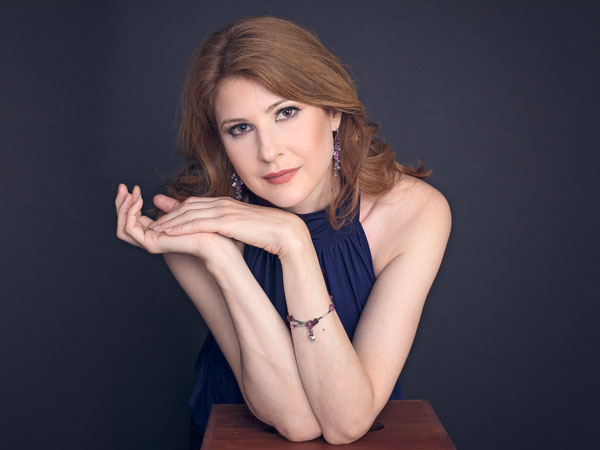 artist wearing bellflower earrings and bracelet
